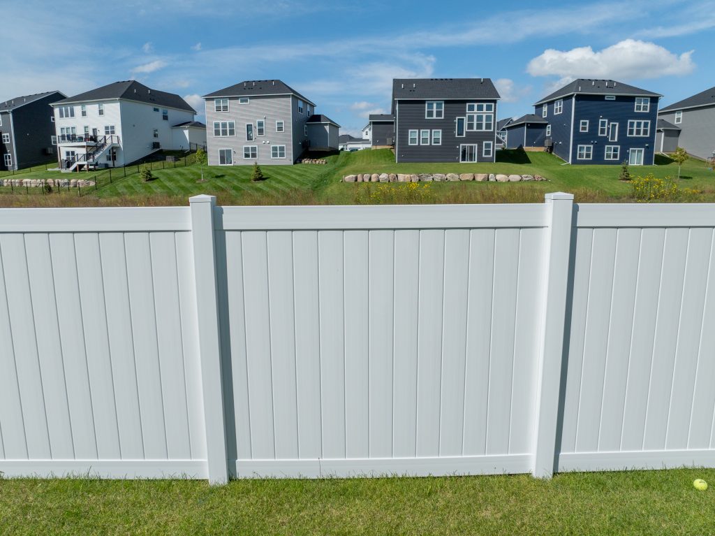 close up of white vinyl fence